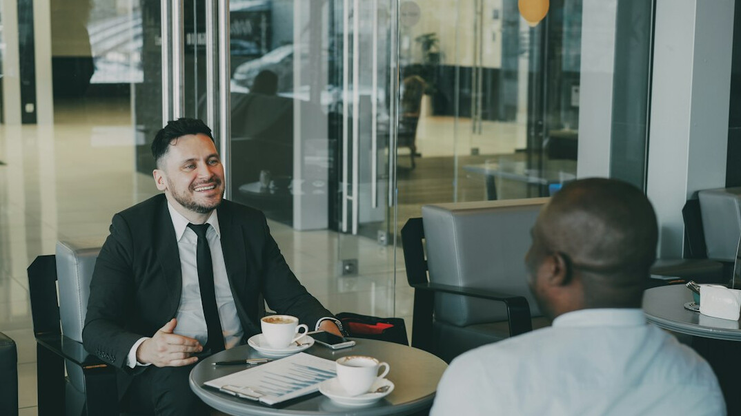man speaking in meeting